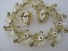 Incredible STAR 1950s plastic and rhinestone flower necklace earring set